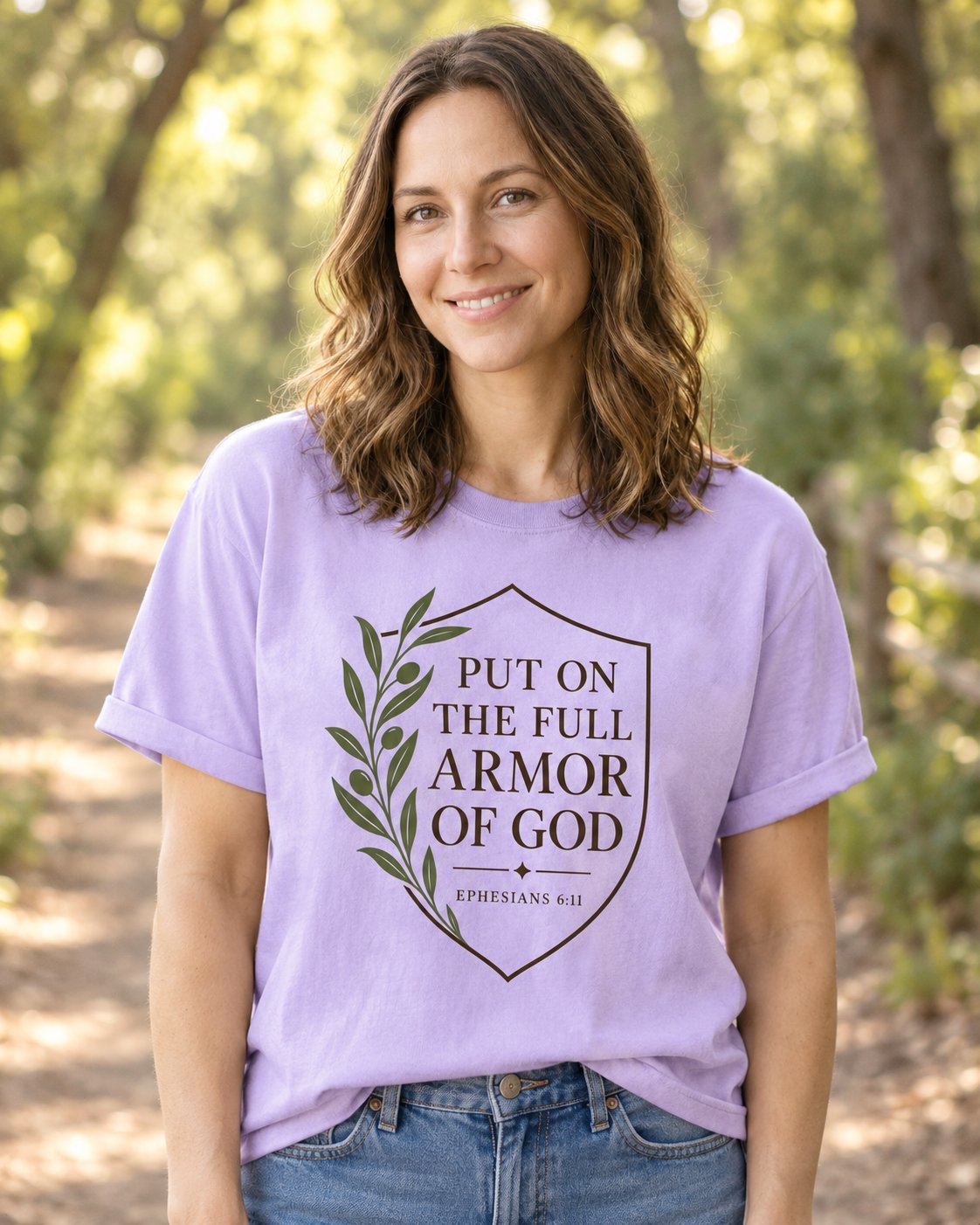 Full Armor of God, Orchid women's Christian tee, lifestyle photo in nature trail, Olive branch and shield with PUT ON THE FULL ARMOR OF GOD, She Wears Faith