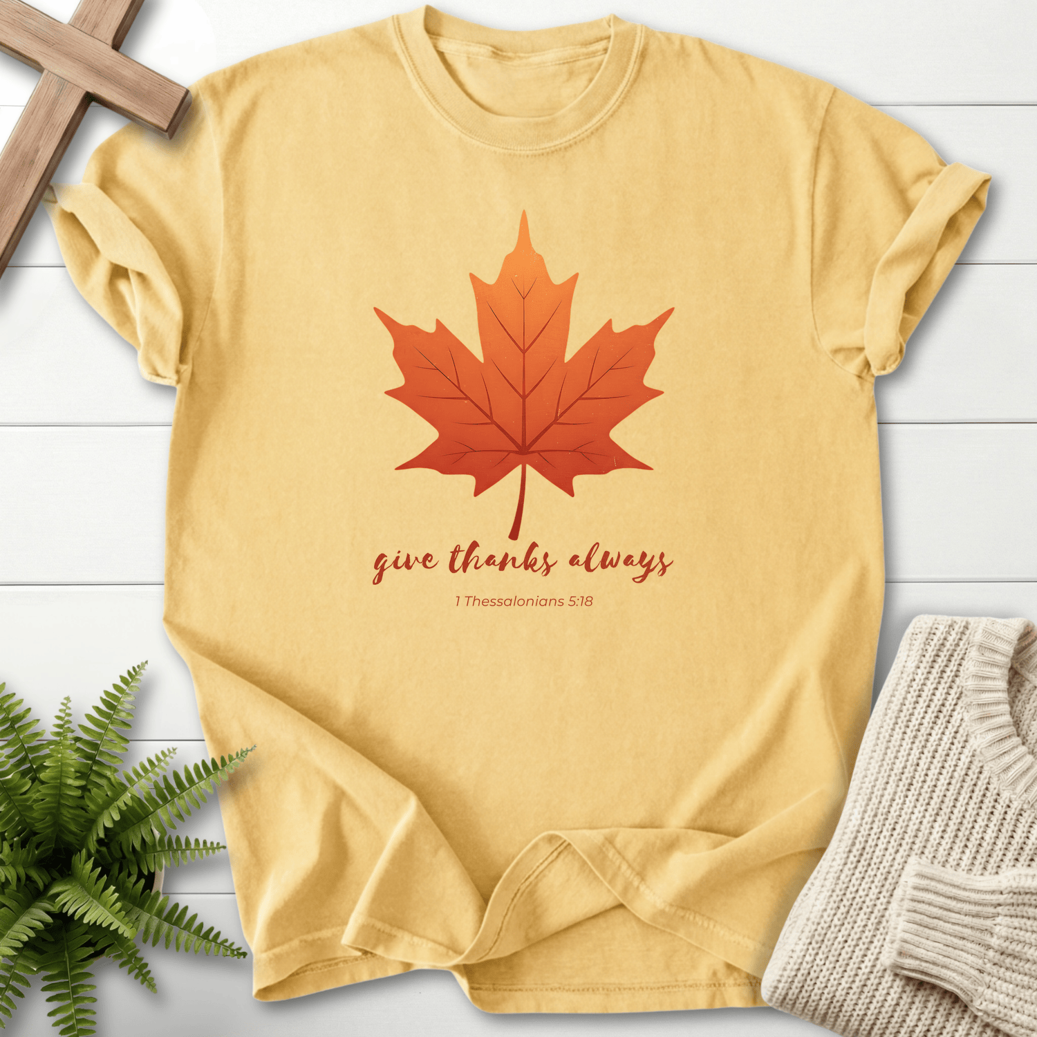 Butter yellow women's faith t-shirt with an autumn maple leaf design and 'Give Thanks Always'.