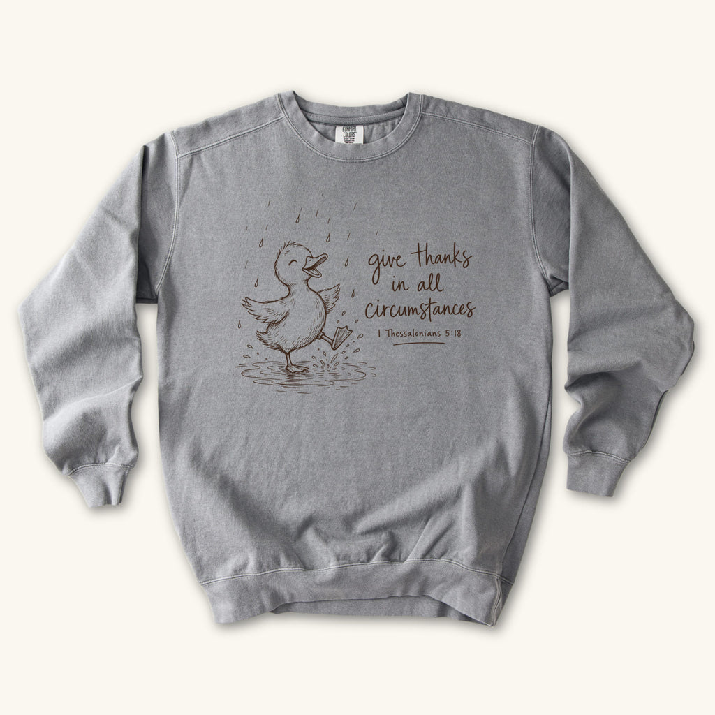 Grey Give Thanks Rainy Day Duck sweatshirt flat lay mockup, 1 Thessalonians 5:18 Christian apparel for women
