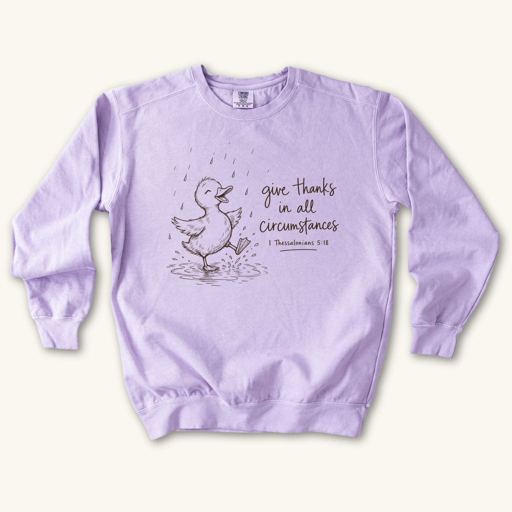 Orchid Give Thanks Rainy Day Duck sweatshirt flat lay mockup, 1 Thessalonians 5:18 Christian apparel for women