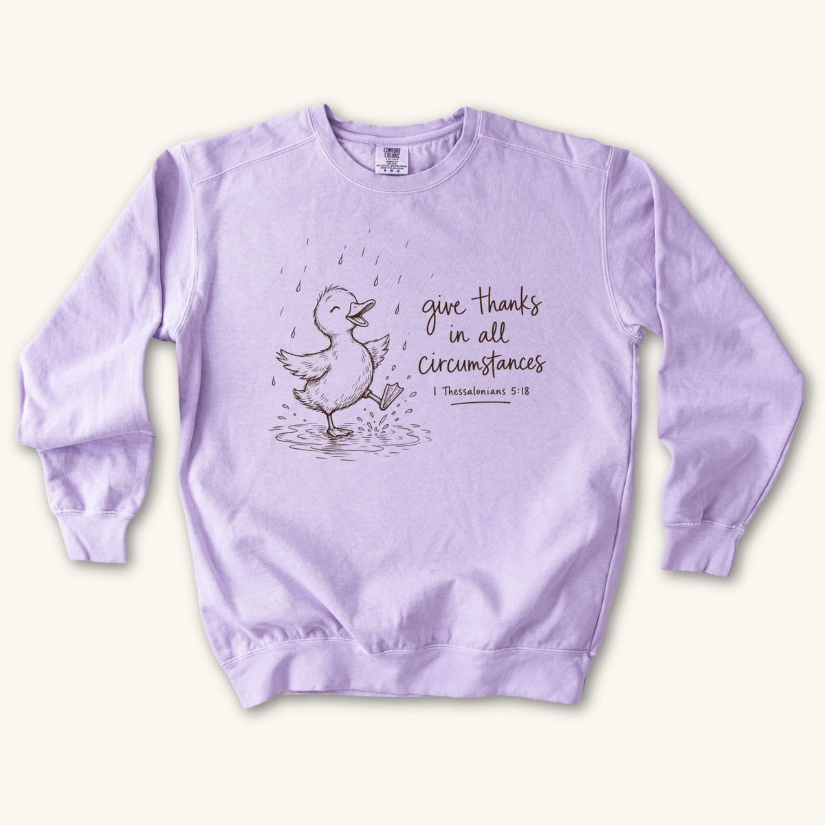 Orchid Give Thanks Rainy Day Duck sweatshirt flat lay mockup, 1 Thessalonians 5:18 Christian apparel for women