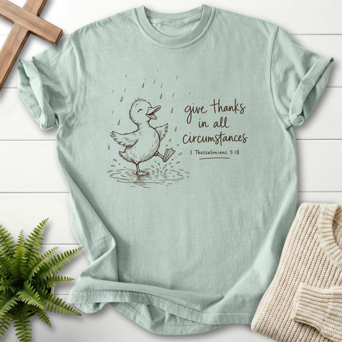 Bay Give Thanks Rainy Day Duck T-shirt flat lay mockup, 1 Thessalonians 5:18 Christian apparel for women