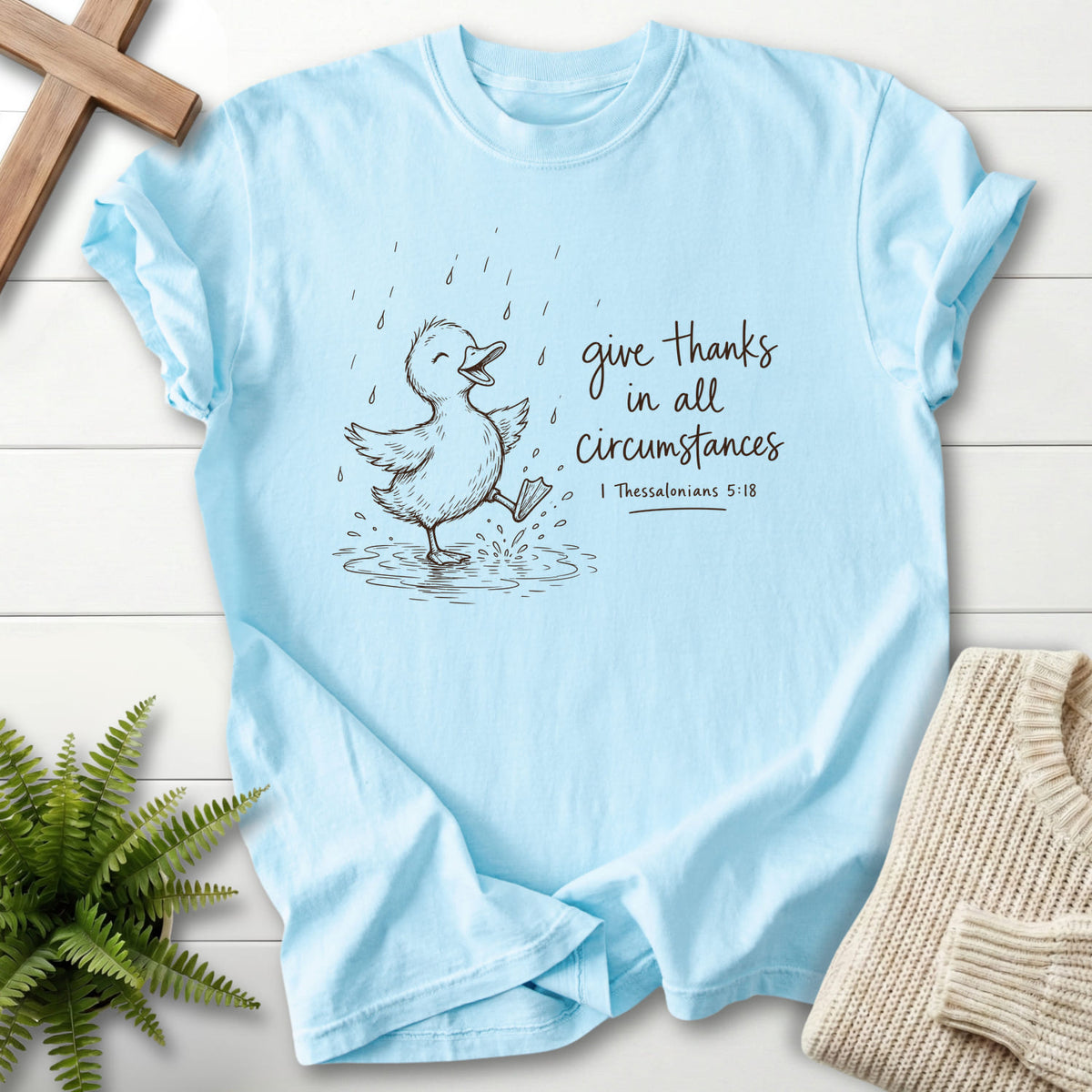 Chambray Give Thanks Rainy Day Duck T-shirt flat lay mockup, 1 Thessalonians 5:18 Christian apparel for women
