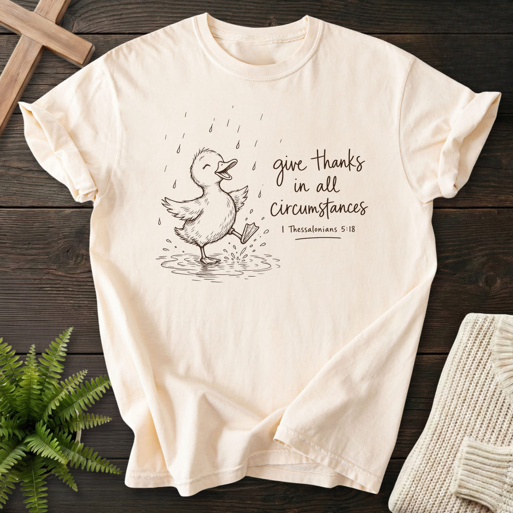 Ivory Give Thanks Rainy Day Duck T-shirt flat lay mockup, 1 Thessalonians 5:18 Christian apparel for women