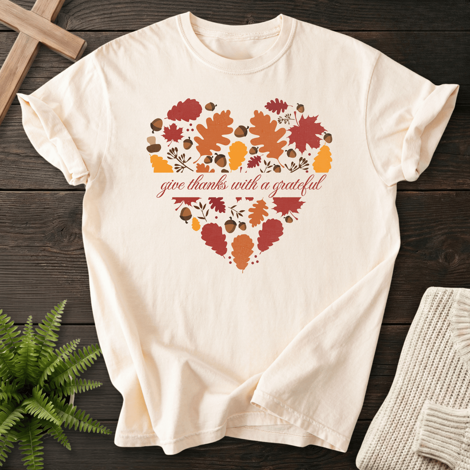 Ivory women's faith t-shirt with a fall leaf heart graphic and 'give thanks with a grateful' script in autumn colors.