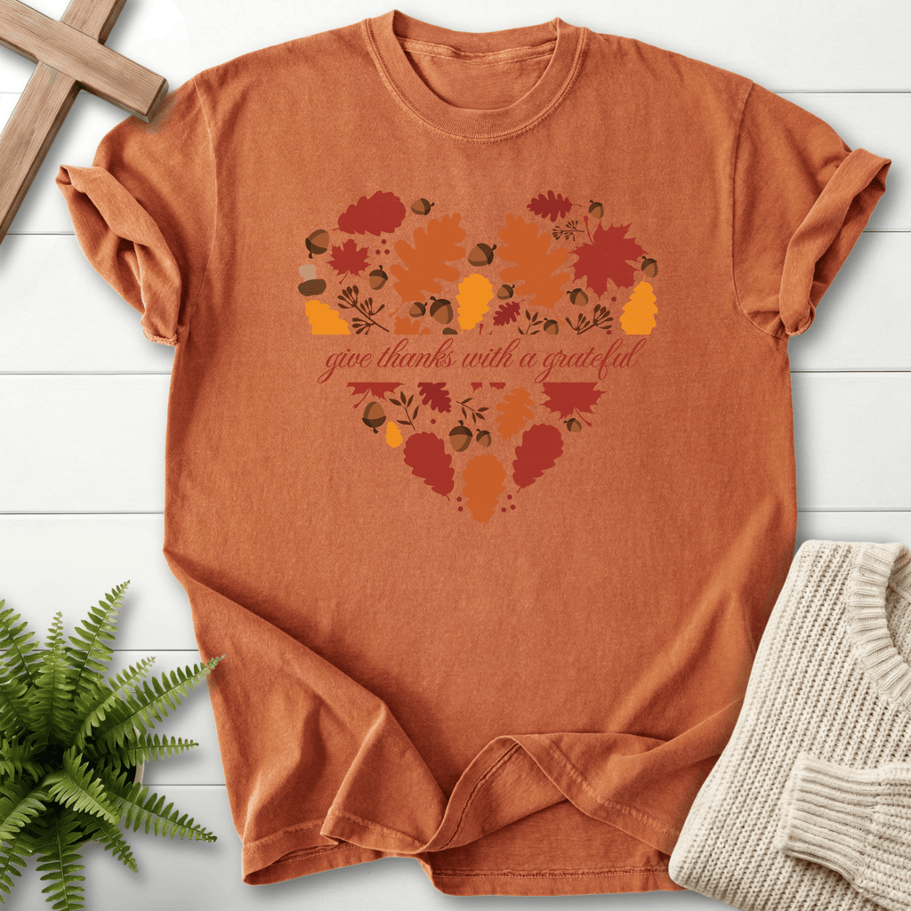 Yam women's faith t-shirt with a heart filled with autumn leaves and acorns and 'give thanks with a grateful' lettering.