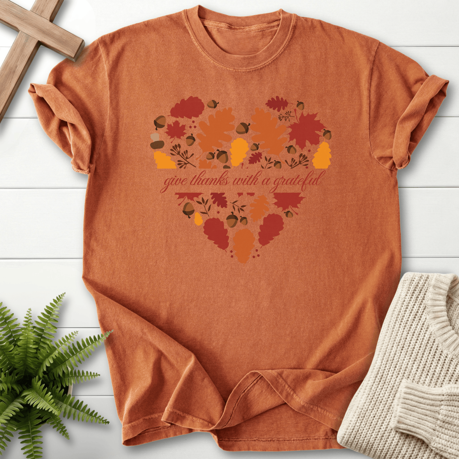 Yam women's faith t-shirt with a heart filled with autumn leaves and acorns and 'give thanks with a grateful' lettering.