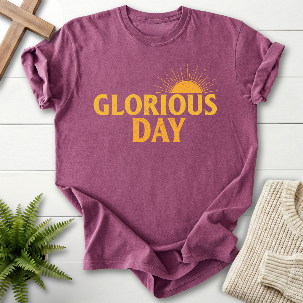 Berry women's faith t-shirt with retro 'Glorious Day' print and a sunrise design in gold.