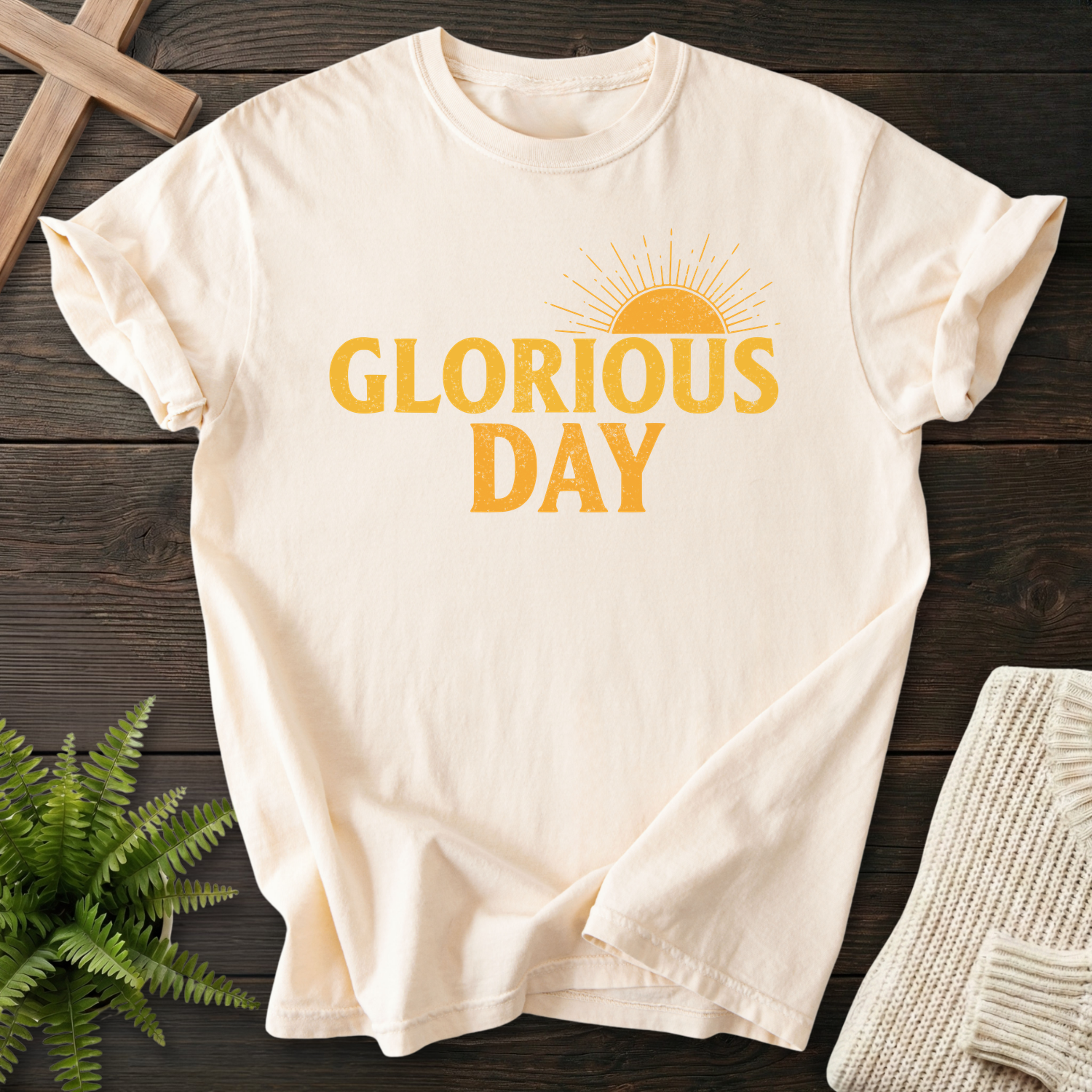 Ivory women's faith t-shirt with 'Glorious Day' in golden bold letters and a sunburst above the text.