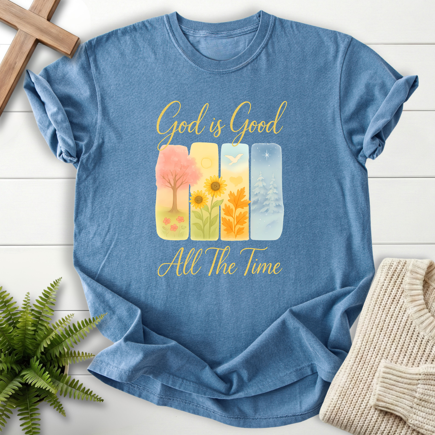 Blue Jean women's faith t-shirt with four seasons watercolor art and 'God is Good All The Time'.