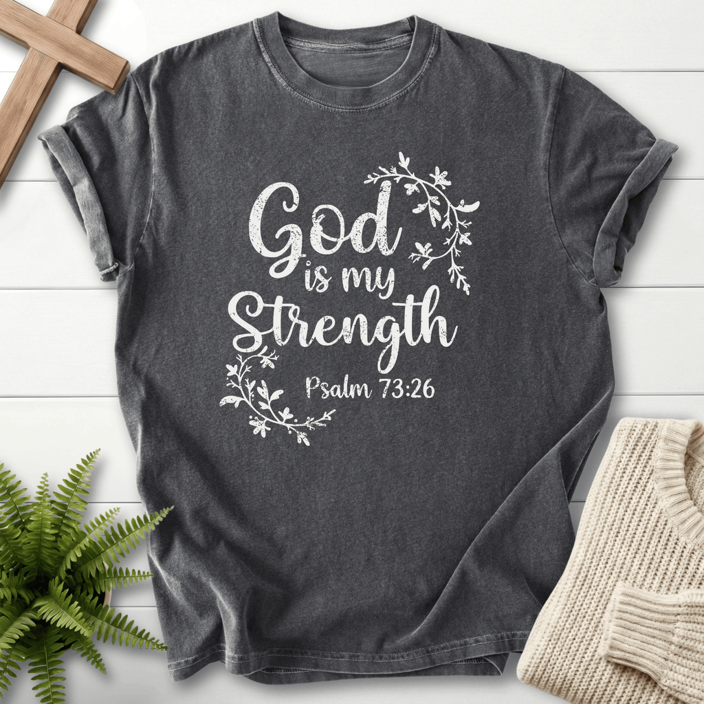 Pepper Bible verse tee with flowing botanical vines and white 'God is my Strength' lettering, inspired by Psalm 73:26.