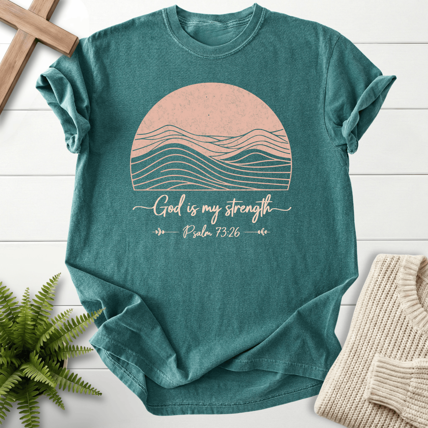 Blue Spruce Bible verse tee with mountain sunset line art and 'God is My Strength', inspired by Psalm 73:26.