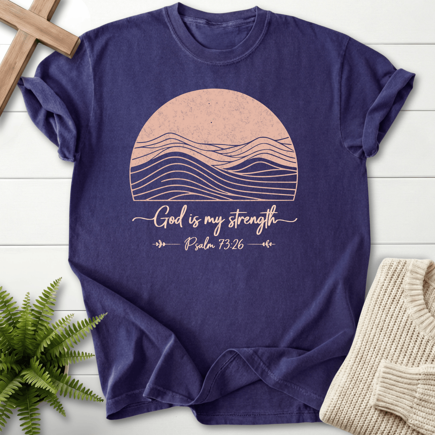 Grape Bible verse tee with a retro sun and mountain silhouette graphic and 'God is My Strength', inspired by Psalm 73:26.