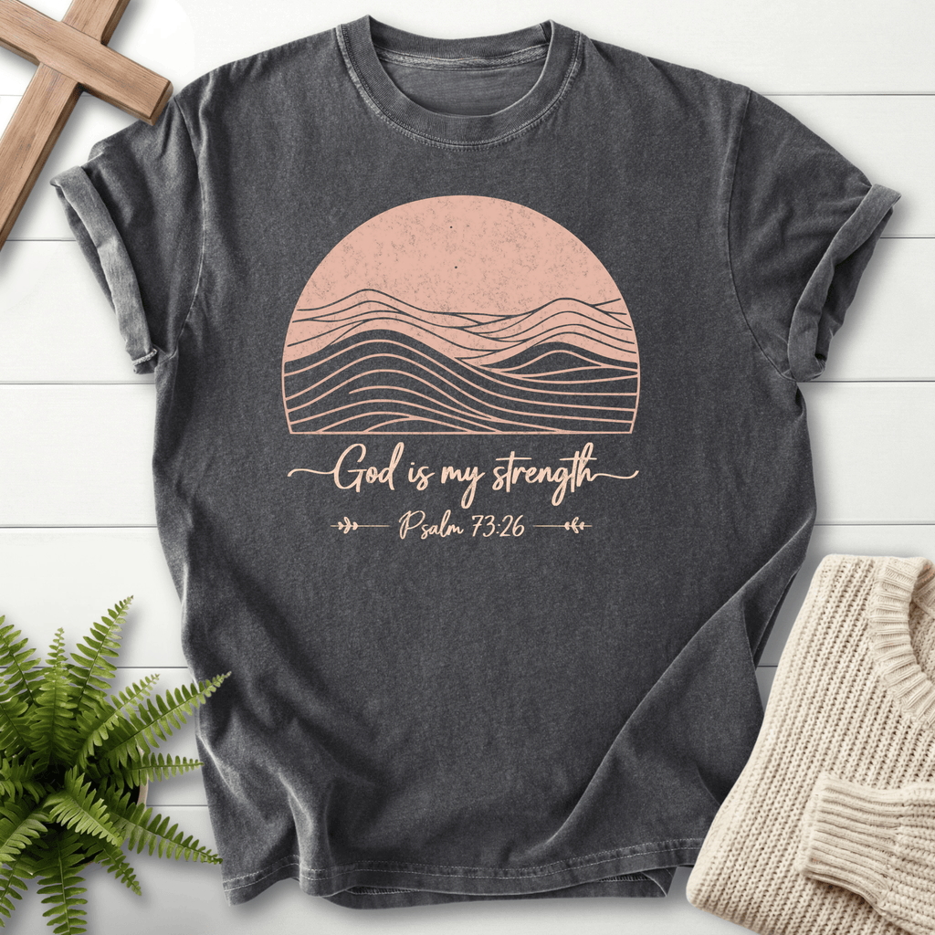Pepper gray Bible verse tee with minimalist mountain peaks inside a sun circle and 'God is My Strength', inspired by Psalm 73:26.
