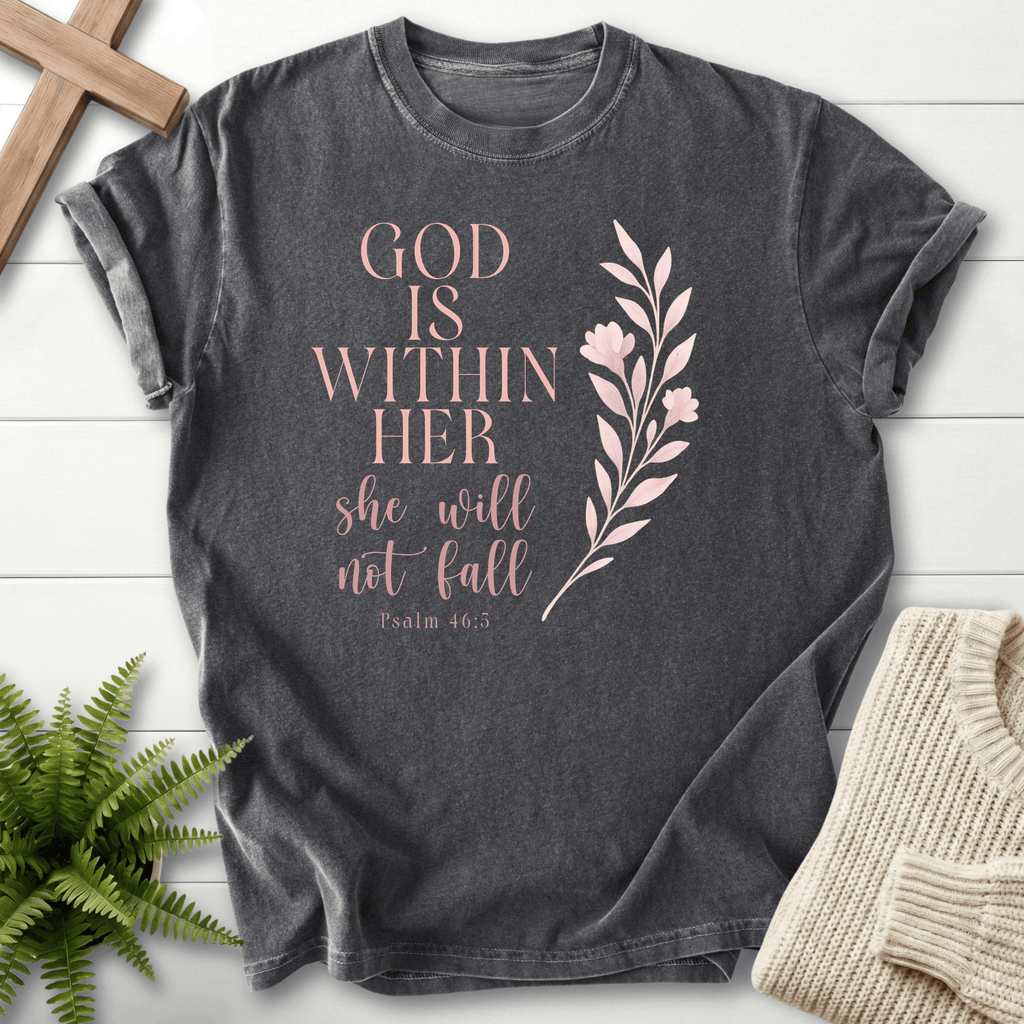 Pepper women's faith t-shirt with 'God is Within Her, She Will Not Fall' and a botanical leaf accent, inspired by Psalm 46:5.