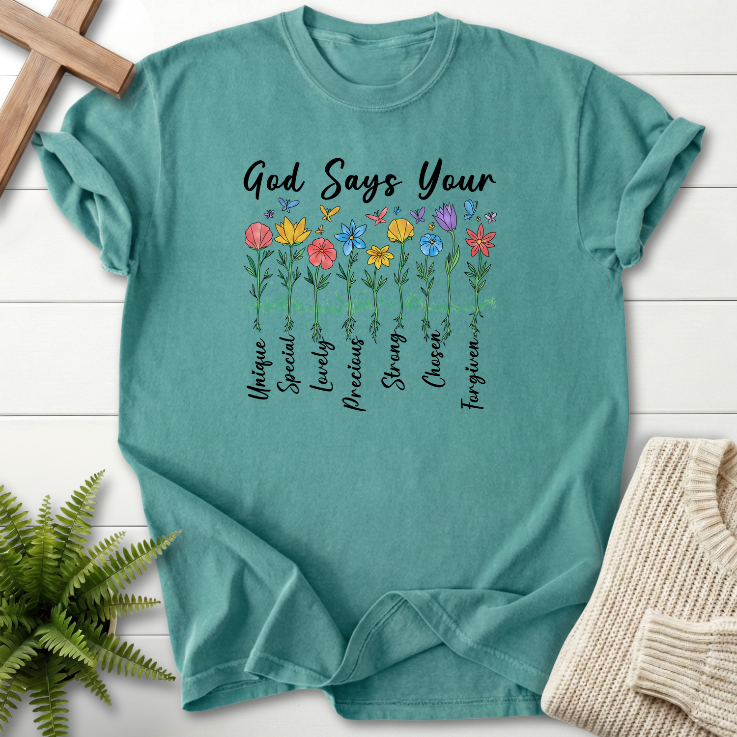 Chalky Mint women's faith t-shirt with 'God Says You Are' and colorful illustrated wildflowers with faith words.