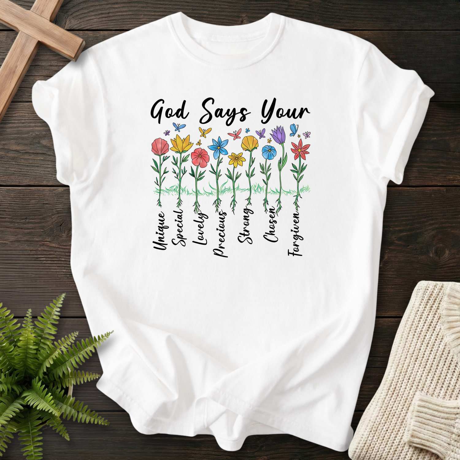 White women's faith t-shirt with hand-drawn wildflower affirmations, Unique, Lovely, Precious, Chosen, and Forgiven.