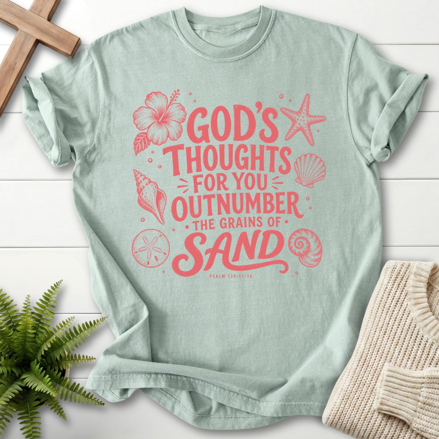 Flat lay of a Bay garment-dyed Christian tee featuring flower artwork with "God's Thought For You Outnumber T-Shirt" Psalm 139:17-18 From Printify.