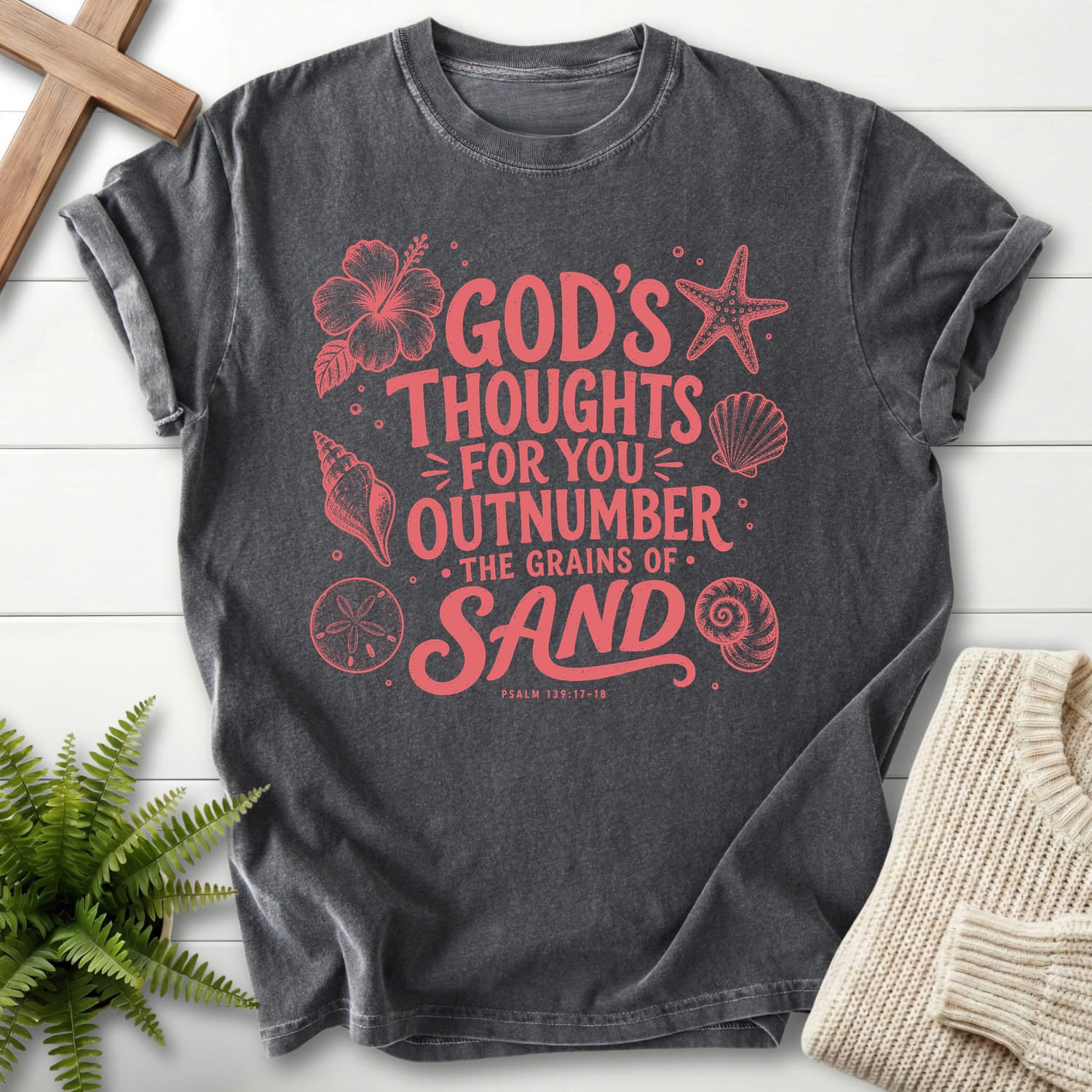 Flat lay of a Pepper Comfort Colors 1717 faith-based tee featuring flower artwork with "God's Thought For You Outnumber T-Shirt" Psalm 139:17-18.