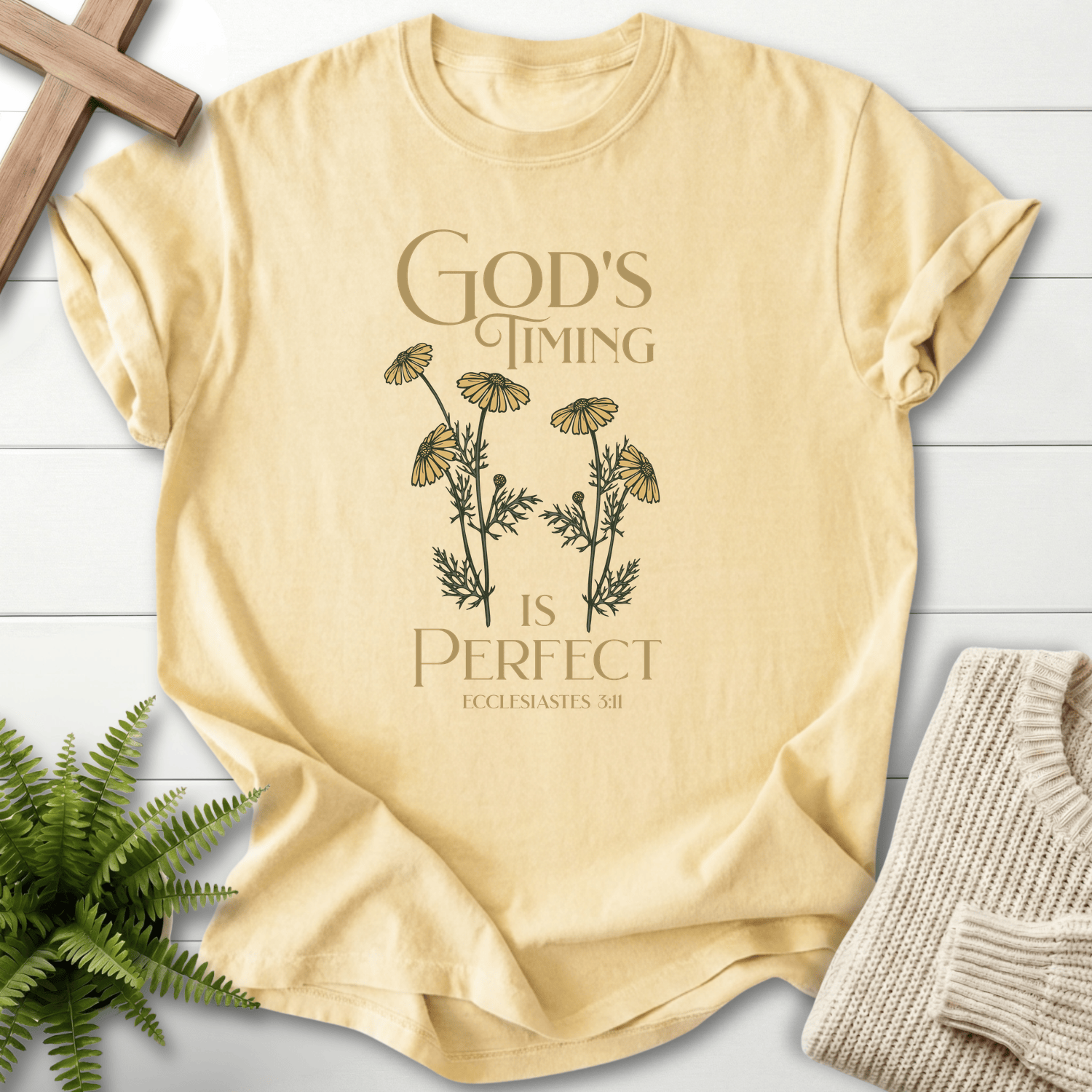 Banana yellow Bible verse tee with a botanical daisy motif and 'God's Timing is Perfect', inspired by Ecclesiastes 3:11.