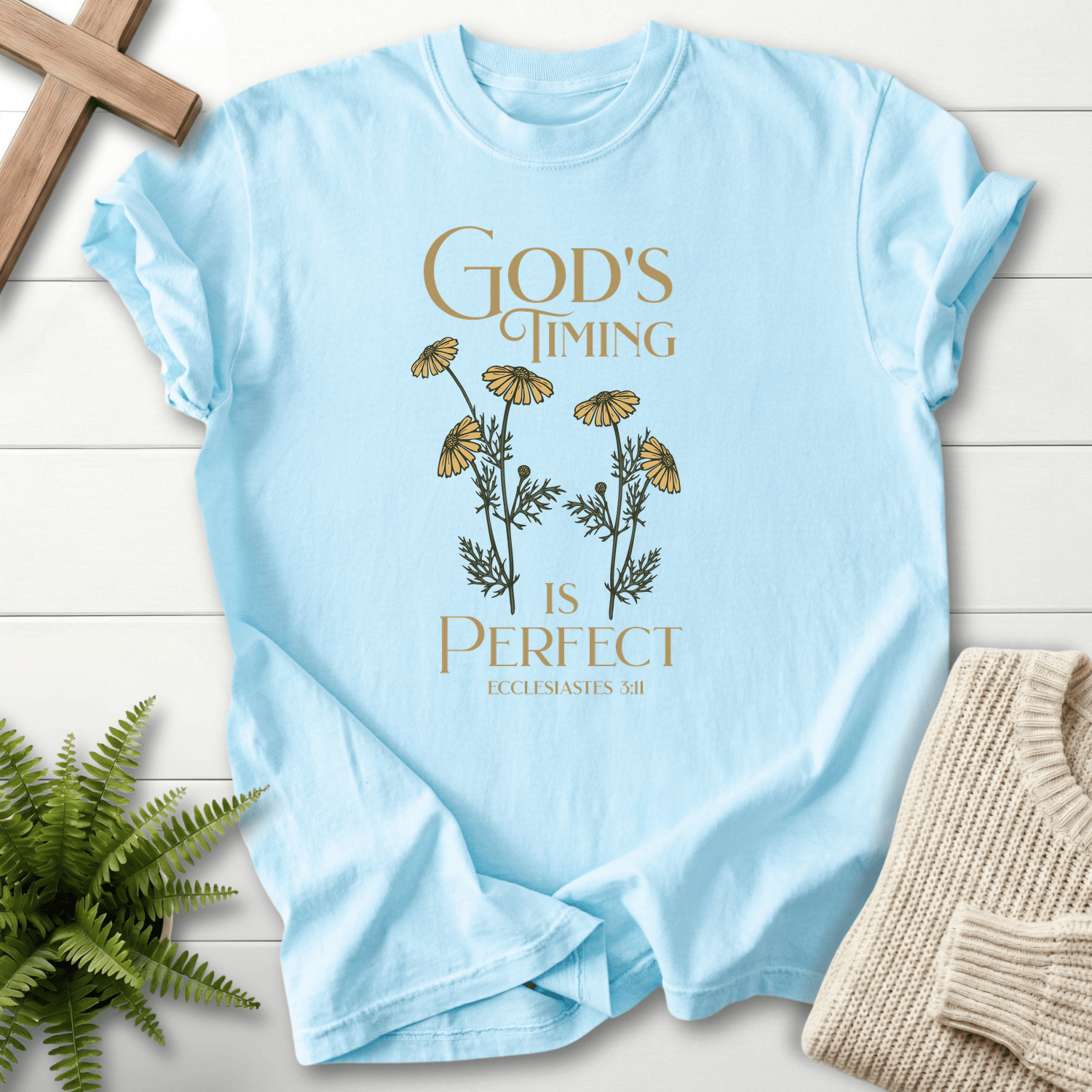 Chambray women's faith t-shirt with a chamomile flower illustration and 'God's Timing is Perfect', inspired by Ecclesiastes 3:11.
