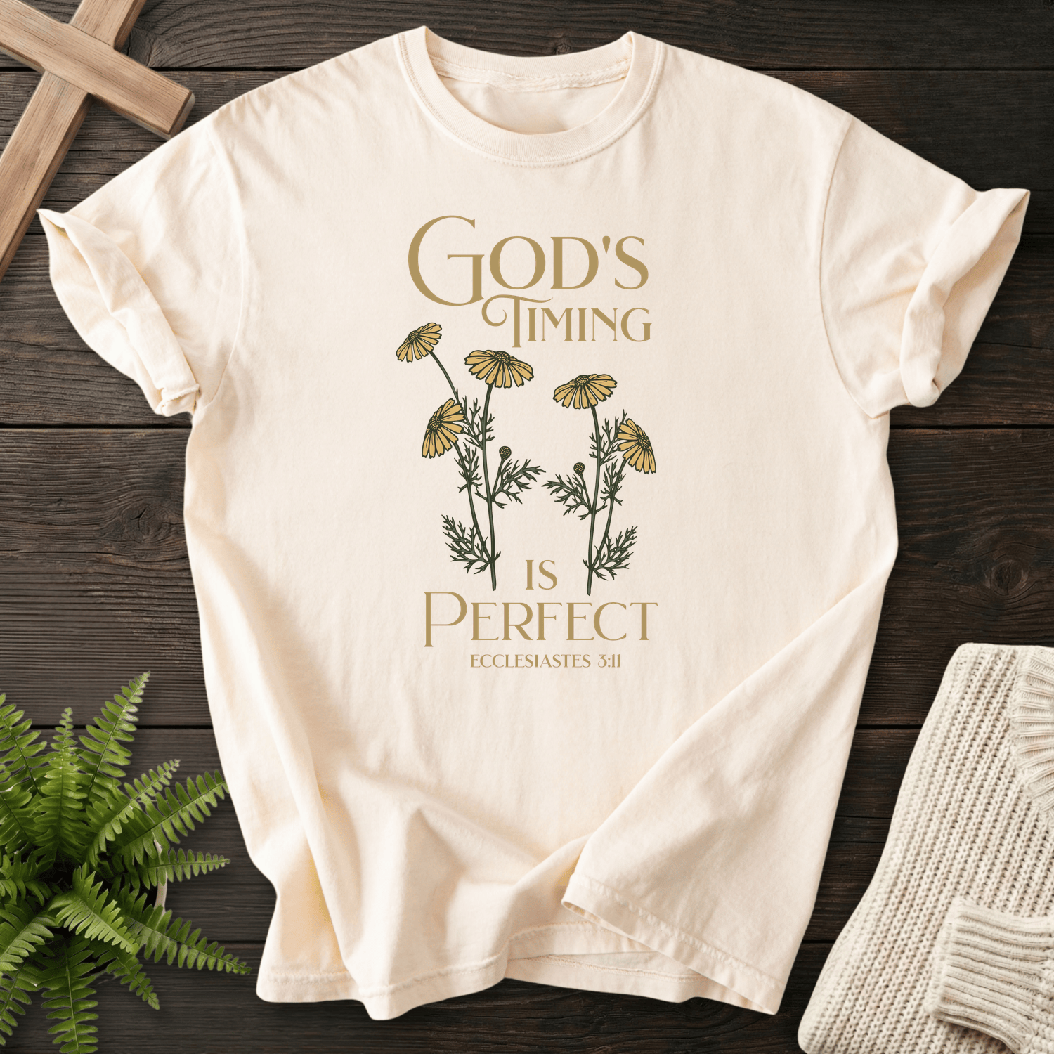 Ivory Bible verse tee with botanical chamomile daisies and 'God's Timing is Perfect', inspired by Ecclesiastes 3:11.