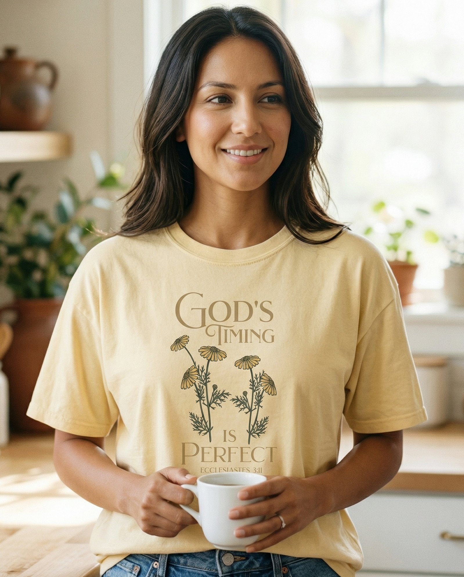 God's Timing Is Perfect – Banana women's Christian tee, lifestyle photo in morning kitchen setting – Botanical line-art chamomile daisies with stems and foliage framing st – Ecclesiastes 3:11 – She Wears Faith