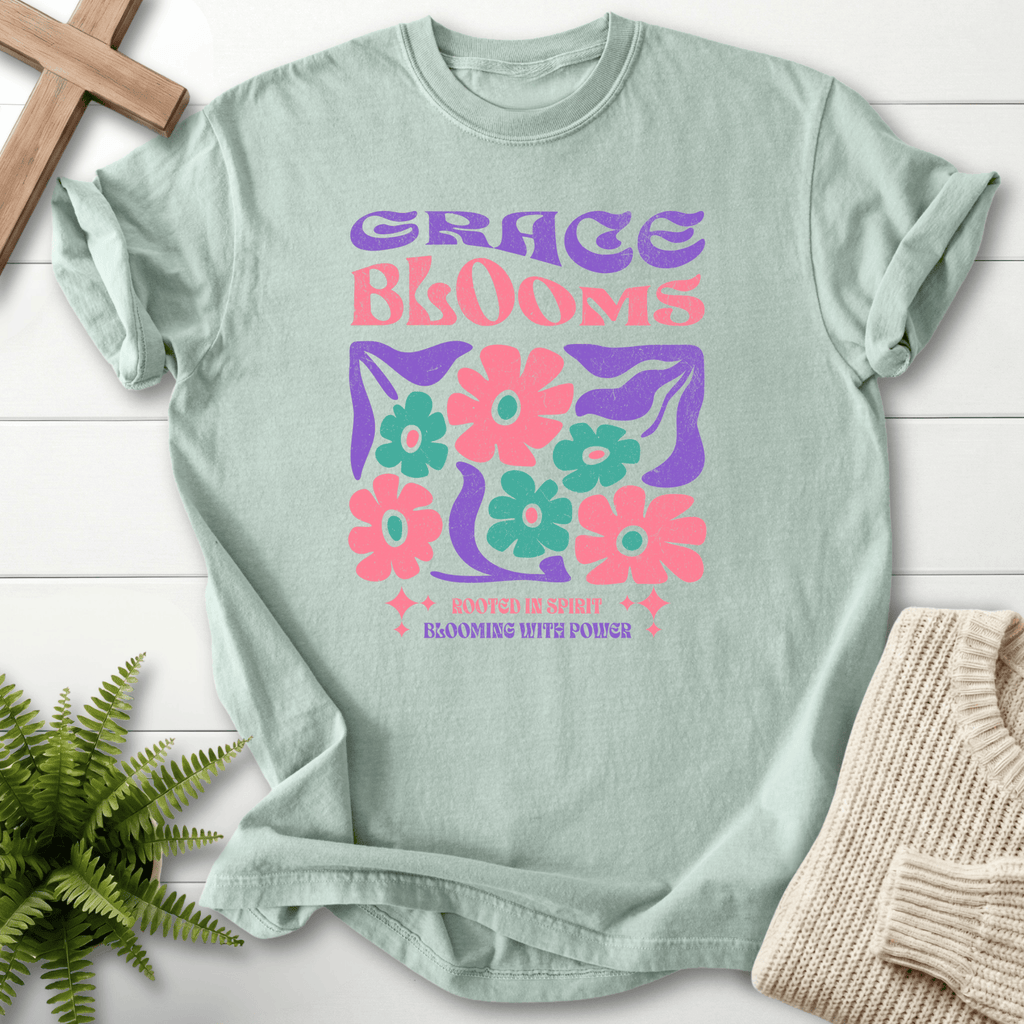 Bay blue women's faith t-shirt with 'Grace Blooms, Rooted in Spirit, Blooming with Power' in a vintage floral retro design.