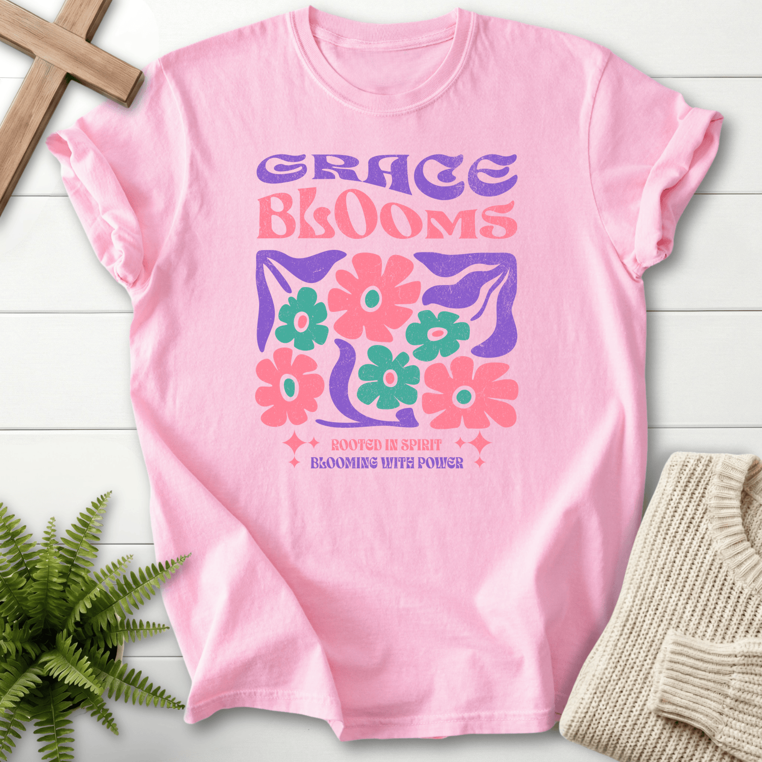 Blossom women's faith t-shirt with a groovy 'Grace Blooms' graphic and a pink teal daisy bouquet.