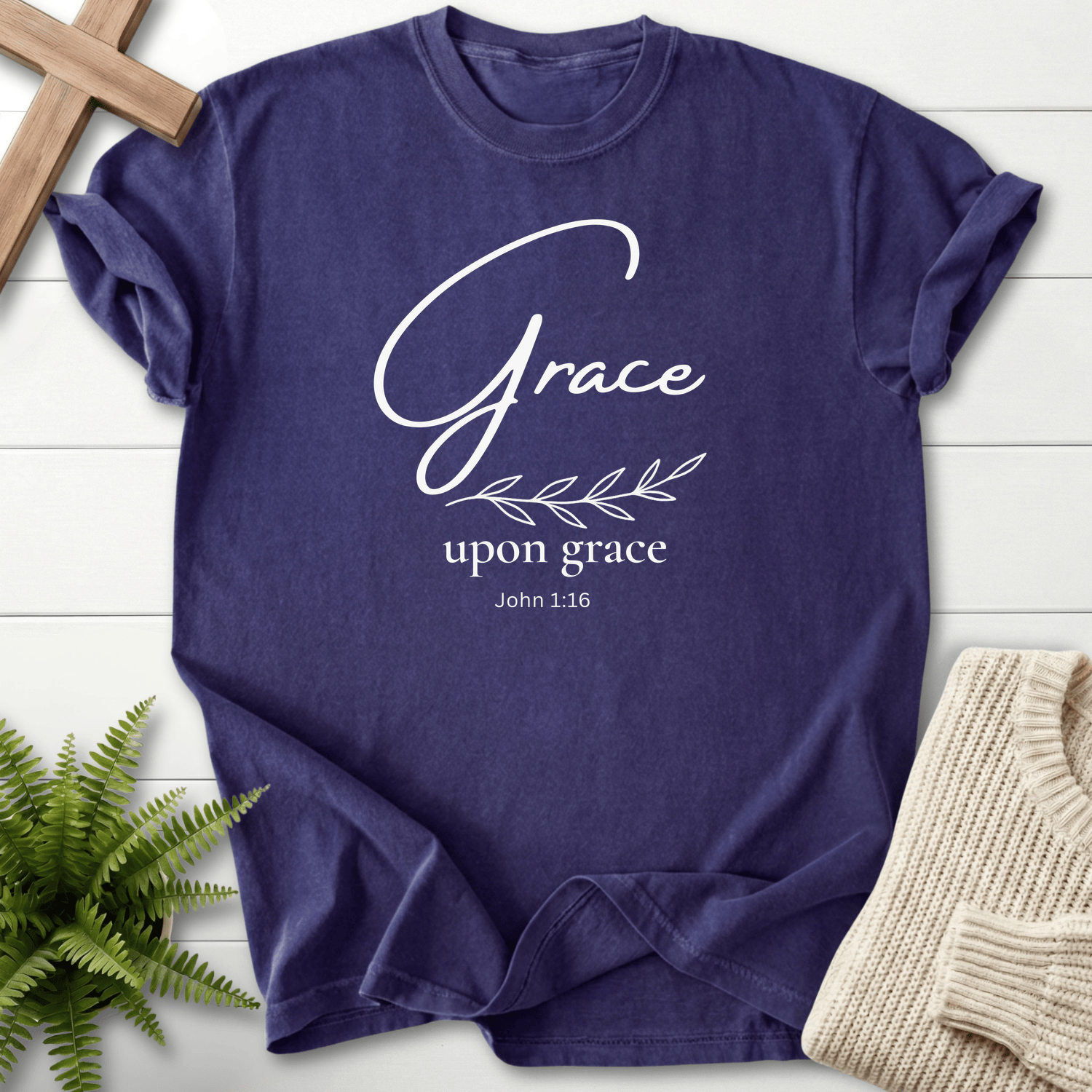 Grape Bible verse tee with minimalist gold 'Grace upon grace' lettering and a botanical sprig, inspired by John 1:16.