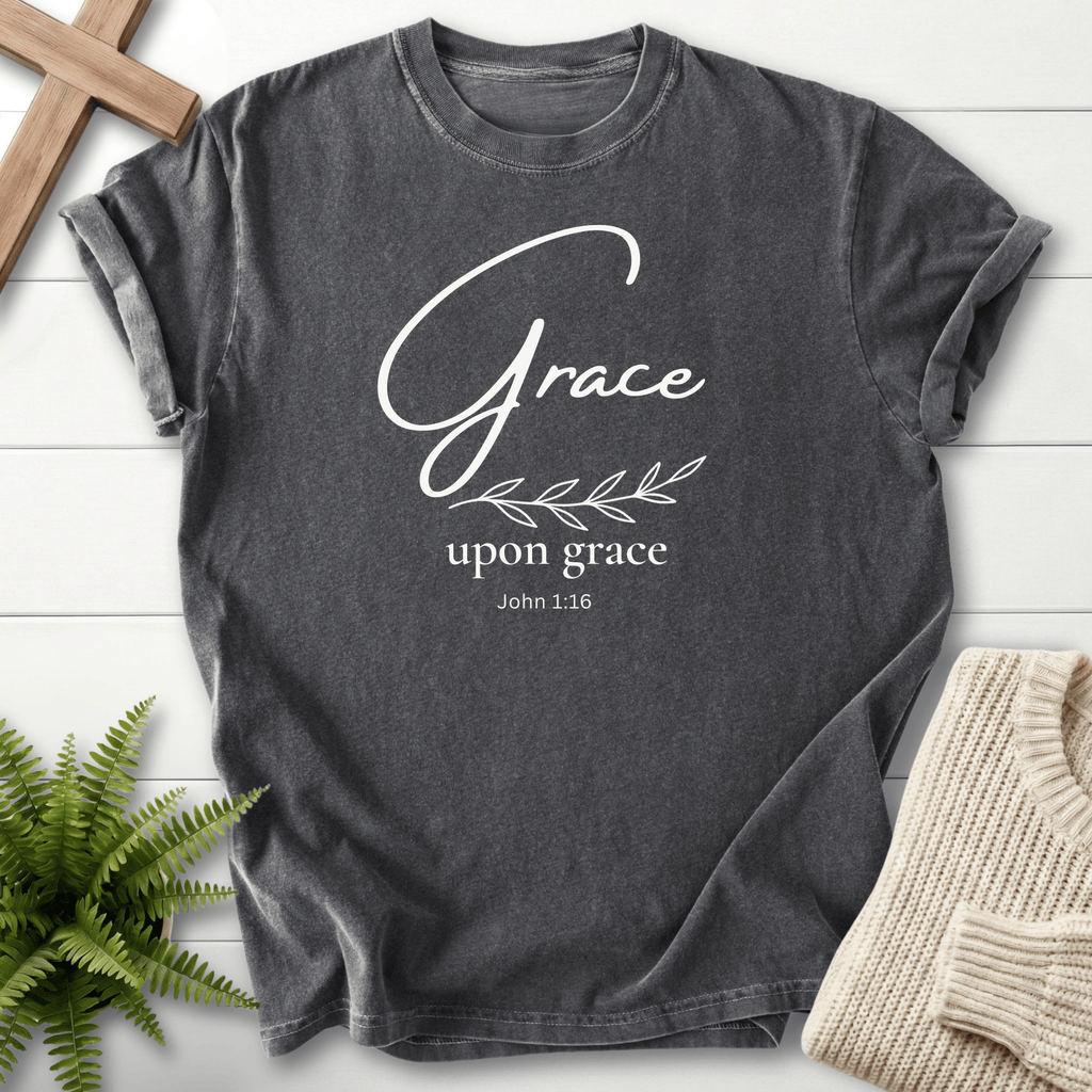 Pepper women's faith t-shirt with gold 'Grace upon grace' script and a single olive branch, inspired by John 1:16.