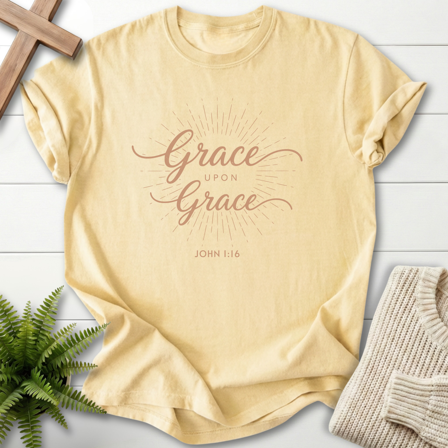 Banana yellow Bible verse tee with glowing cursive 'Grace Upon Grace' surrounded by light rays, inspired by John 1:16.
