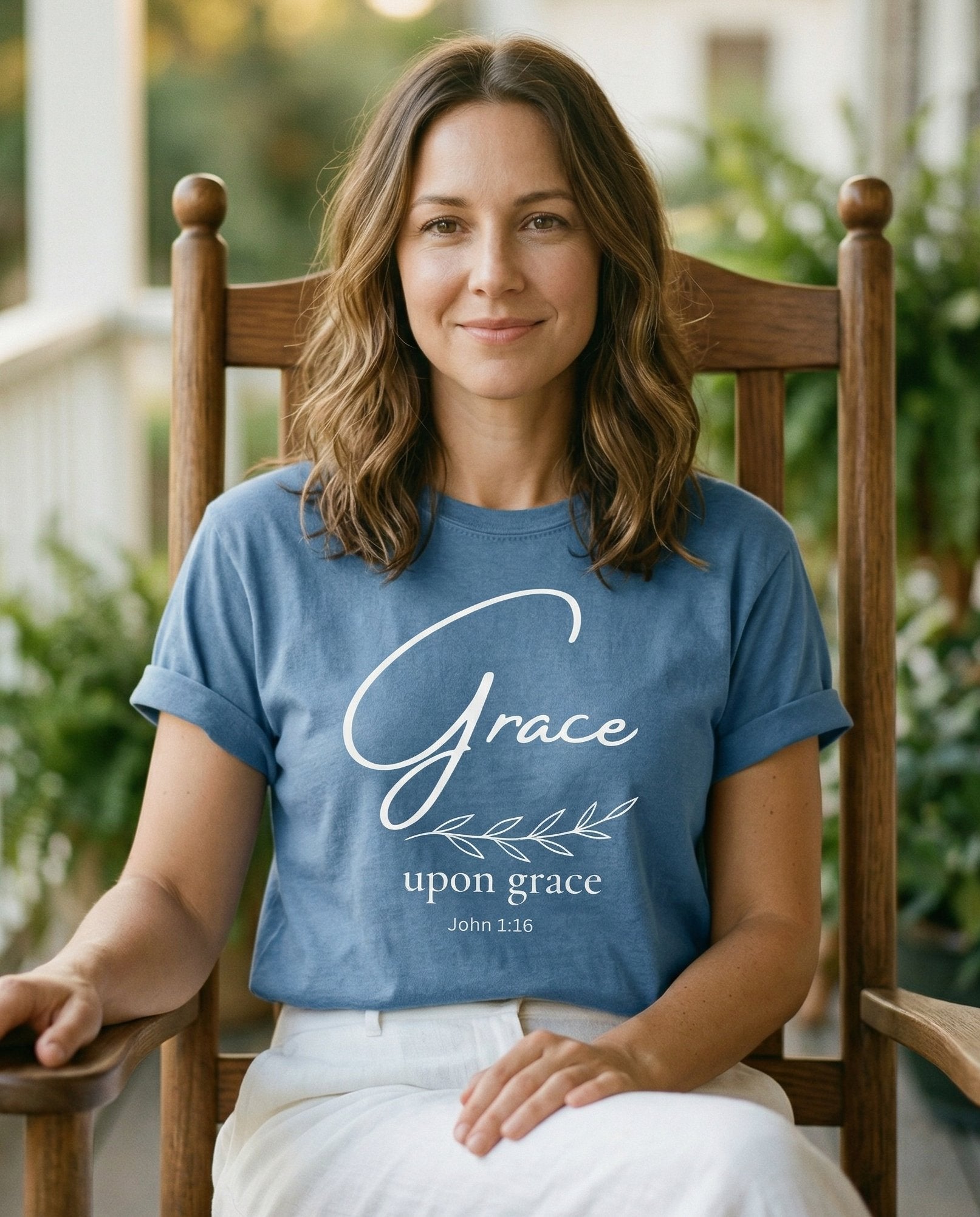 Grace Upon Grace – Blue Jean women's Christian tee, lifestyle photo in sunny porch – Minimalist design with a large script 'Grace' above smaller 'upon grac – John 1:16 – She Wears Faith