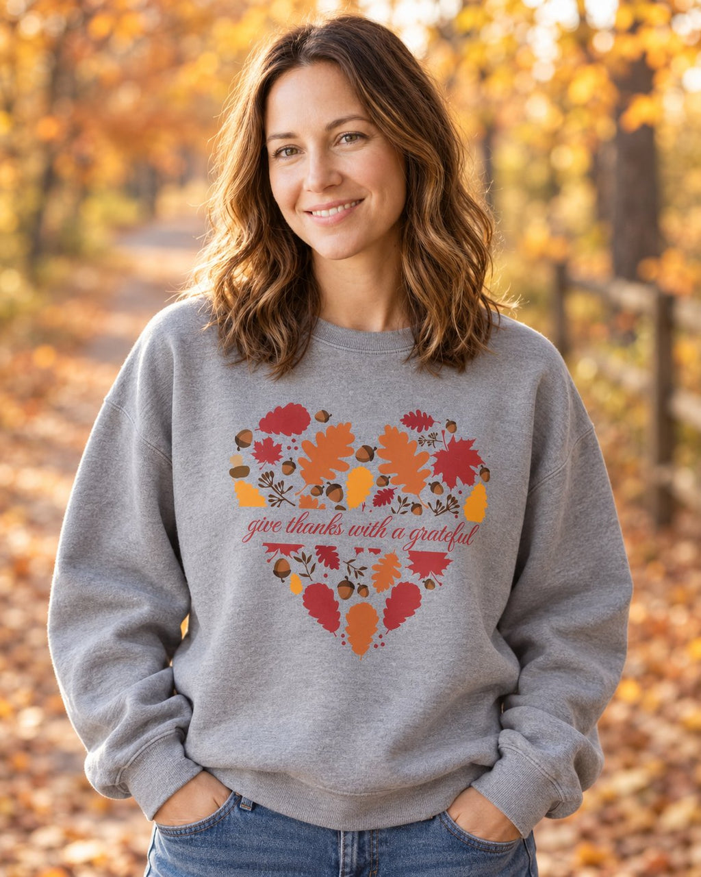 Grateful Heart Fall, Grey women's Christian sweatshirt, lifestyle photo in cozy autumn harvest setting, Heart of autumn leaves with give thanks script, She Wears Faith