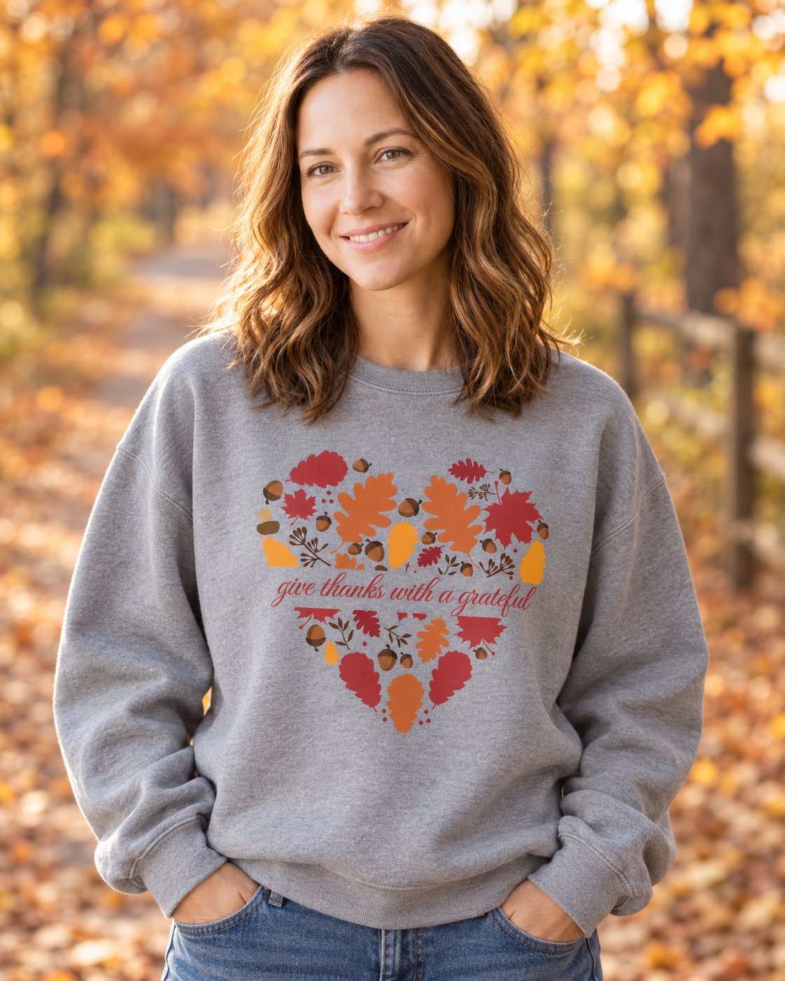 Grateful Heart Fall, Grey women's Christian sweatshirt, lifestyle photo in cozy autumn harvest setting, Heart of autumn leaves with give thanks script, She Wears Faith