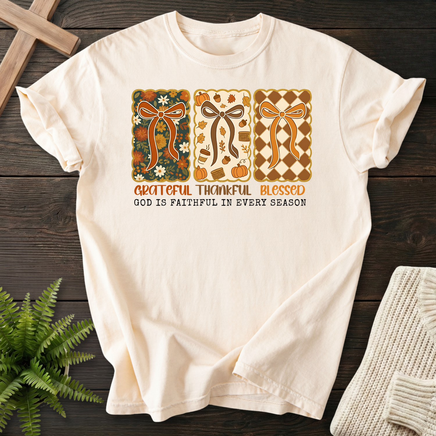 Ivory women's faith t-shirt with three fall bow panels and 'Grateful Thankful Blessed, God is Faithful in Every Season'.