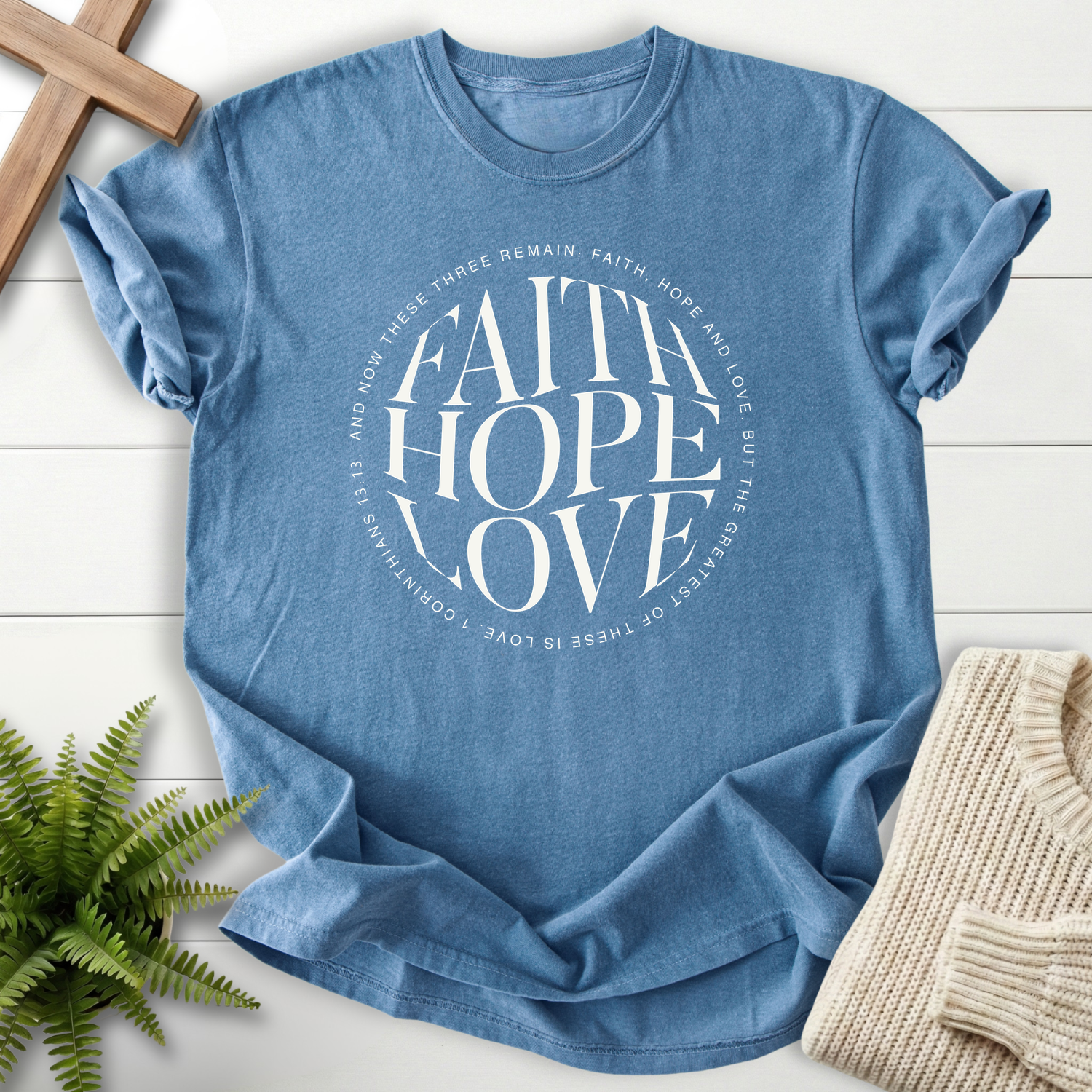 Blue Jean women's faith t-shirt with a bold circular minimalist design and white lettering, inspired by 1 Corinthians 13:13.