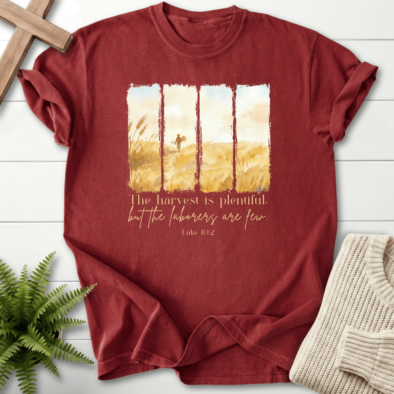 Brick Bible verse tee with a golden harvest field illustration in watercolor panel style, inspired by Luke 10:2.