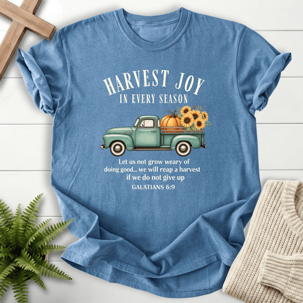 Blue Jean Bible verse tee with a retro teal farm truck hauling pumpkins and sunflowers, inspired by Galatians 6:9.