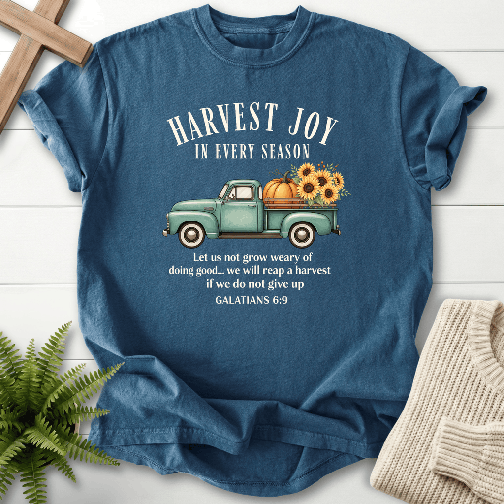 Midnight blue women's faith t-shirt with a vintage harvest truck illustration and 'Harvest Joy in Every Season', inspired by Galatians 6:9.