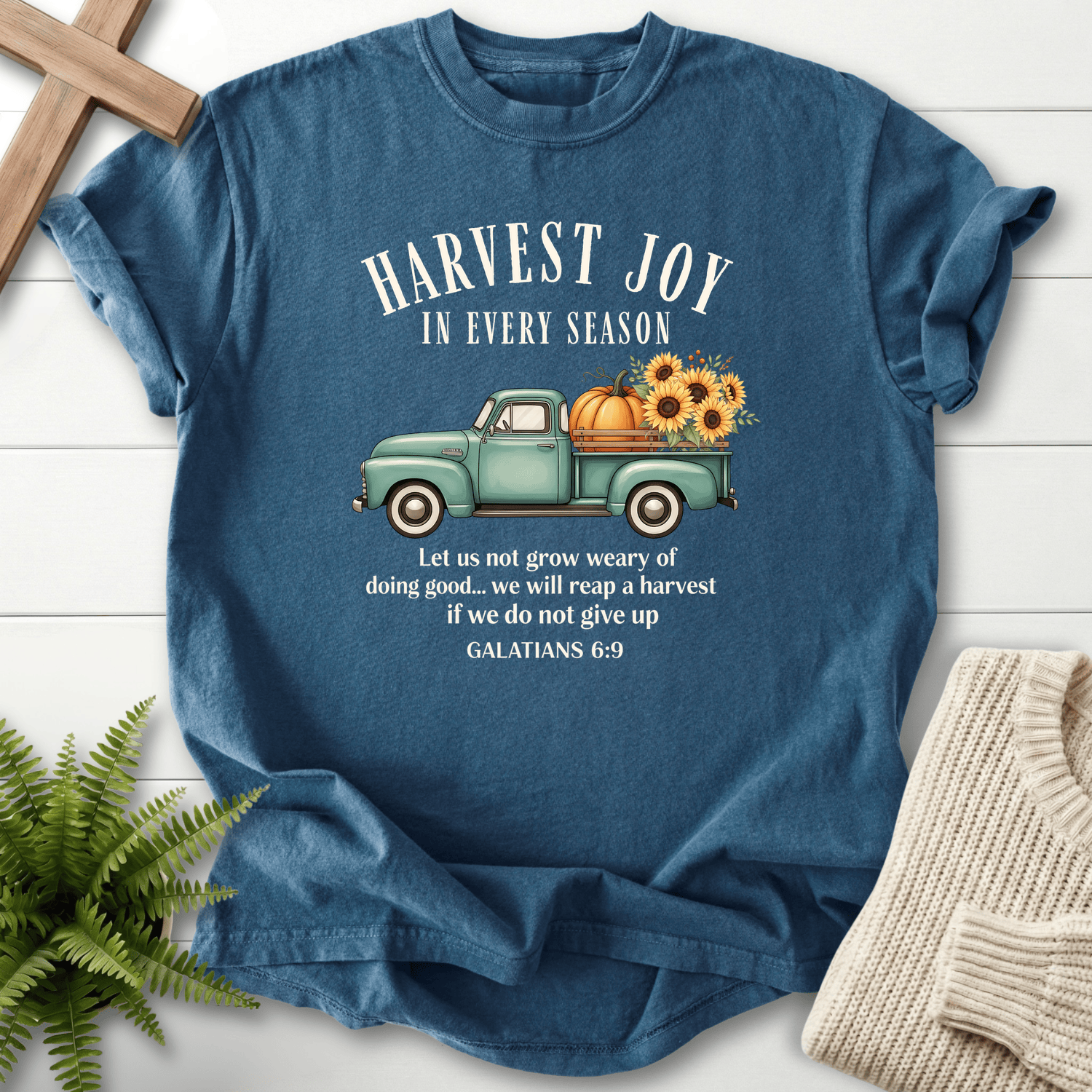 Midnight blue women's faith t-shirt with a vintage harvest truck illustration and 'Harvest Joy in Every Season', inspired by Galatians 6:9.
