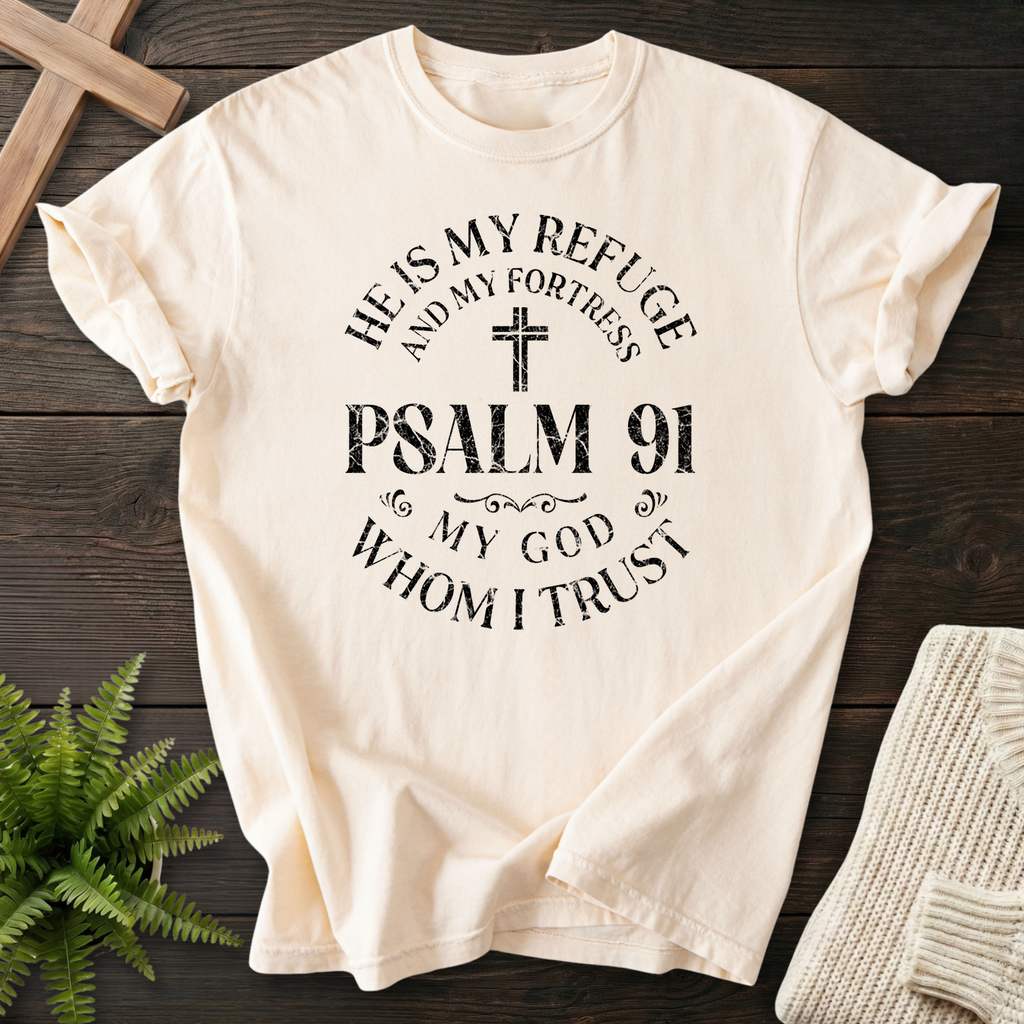 Ivory Bible verse tee with black badge-style 'He is My Refuge and My Fortress, Psalm 91, My God Whom I Trust' print, inspired by Psalm 91.