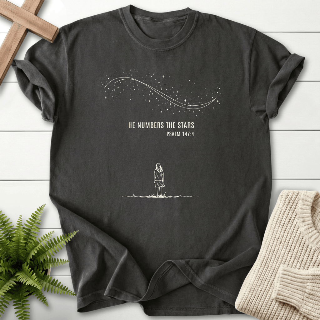 Graphite women's Christian t-shirt with minimalist "He Numbers the Stars" art, inspired by Psalm 147:4