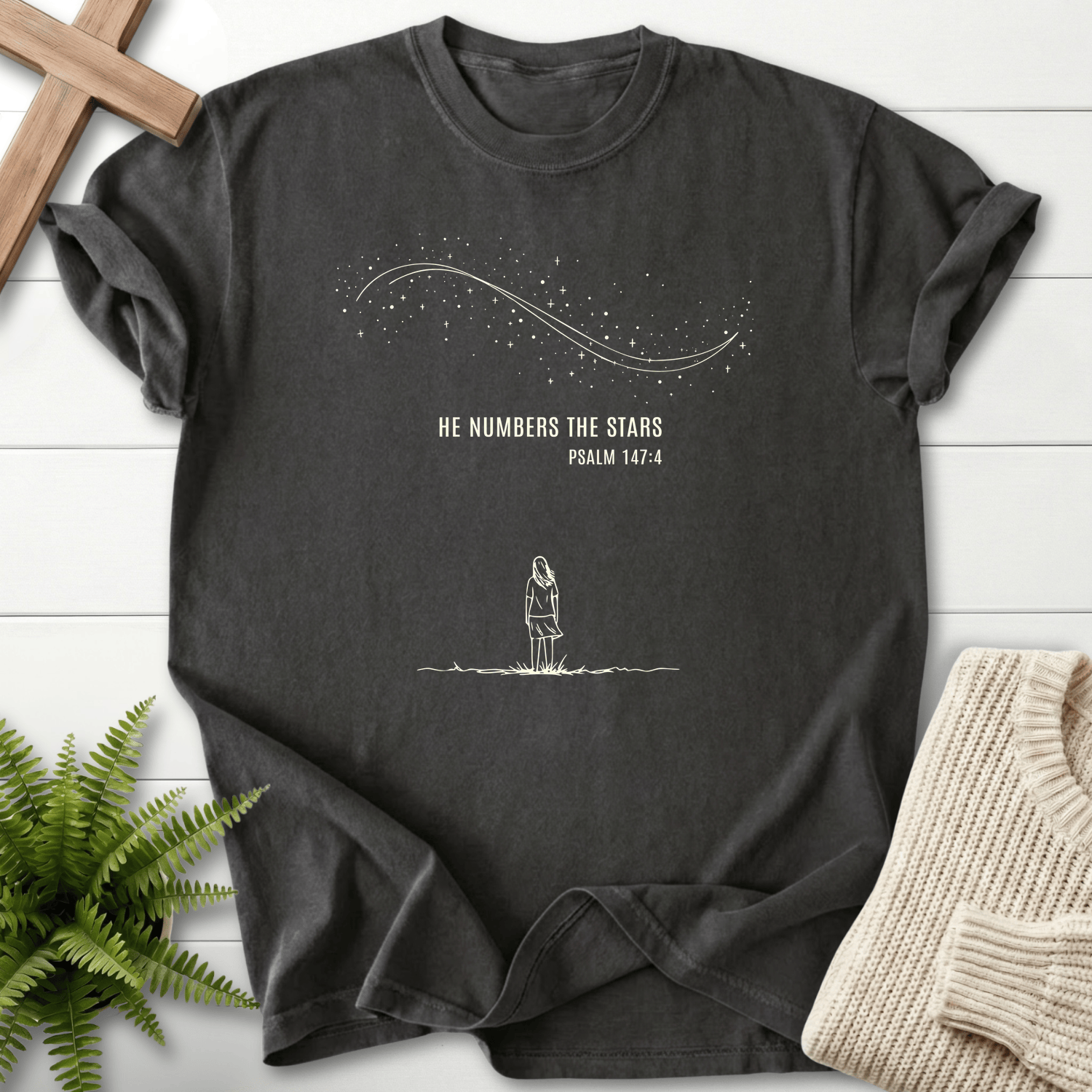 Graphite women's Christian t-shirt with minimalist "He Numbers the Stars" art, inspired by Psalm 147:4