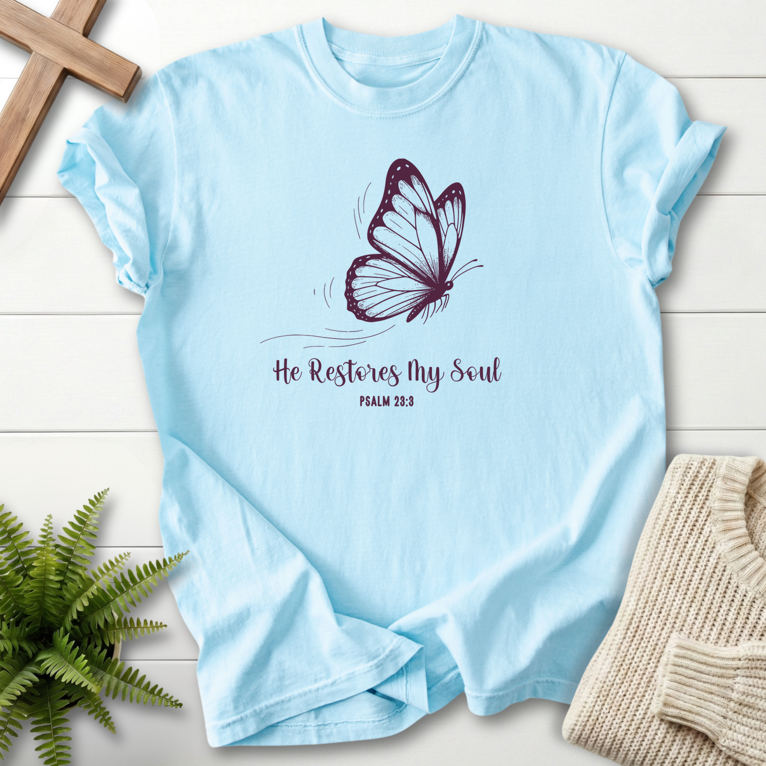 Chambray women's Christian t-shirt with a purple butterfly illustration and "He Restores My Soul," inspired by Psalm 23:3
