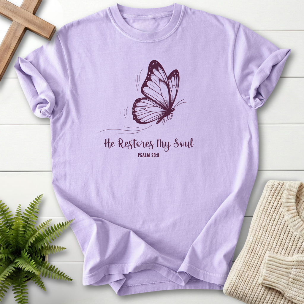 Orchid women's Christian t-shirt with a monarch butterfly design and "He Restores My Soul," inspired by Psalm 23:3