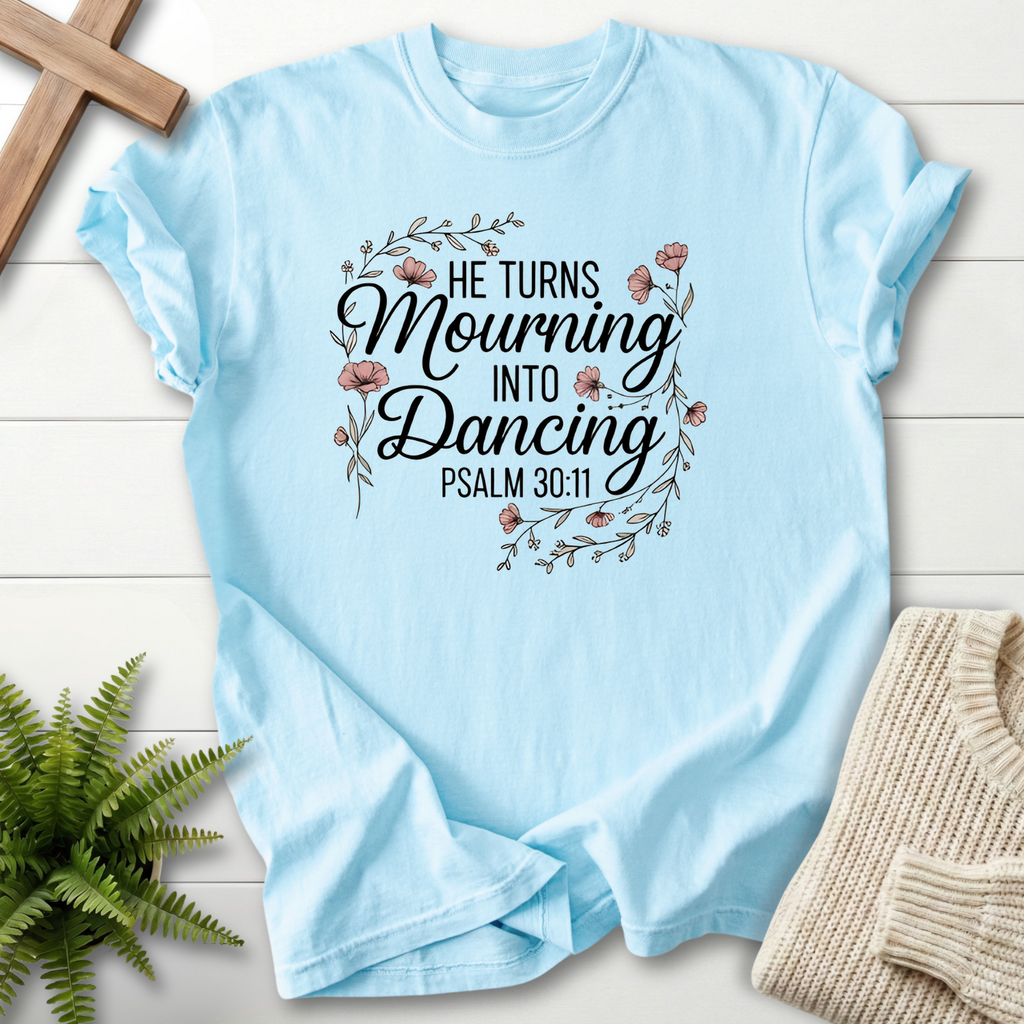 Chambray women's Christian t-shirt with a floral wreath and "He Turns Mourning Into Dancing"