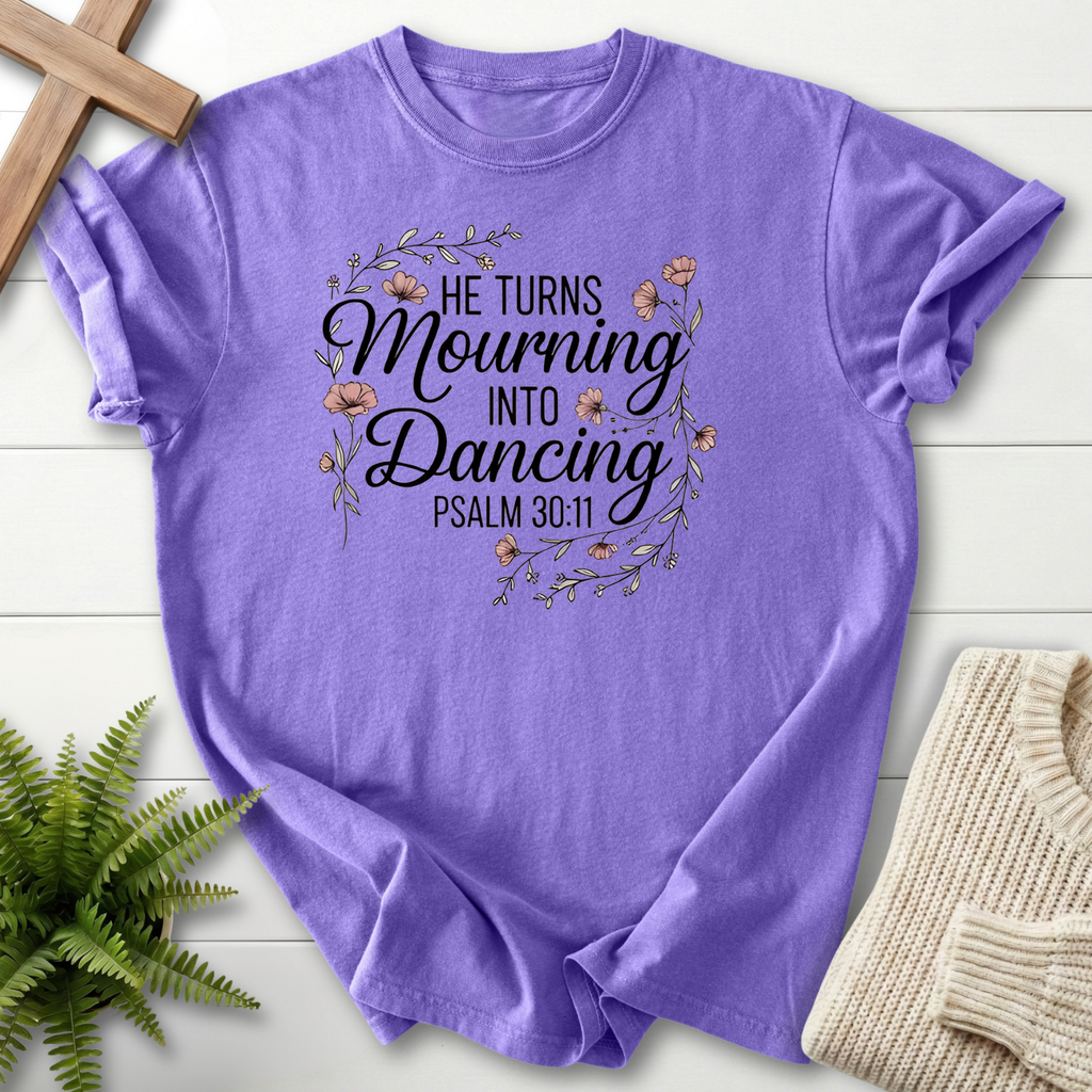 Violet women's Christian t-shirt with a decorative floral border and "He Turns Mourning Into Dancing," inspired by Psalm 30:11