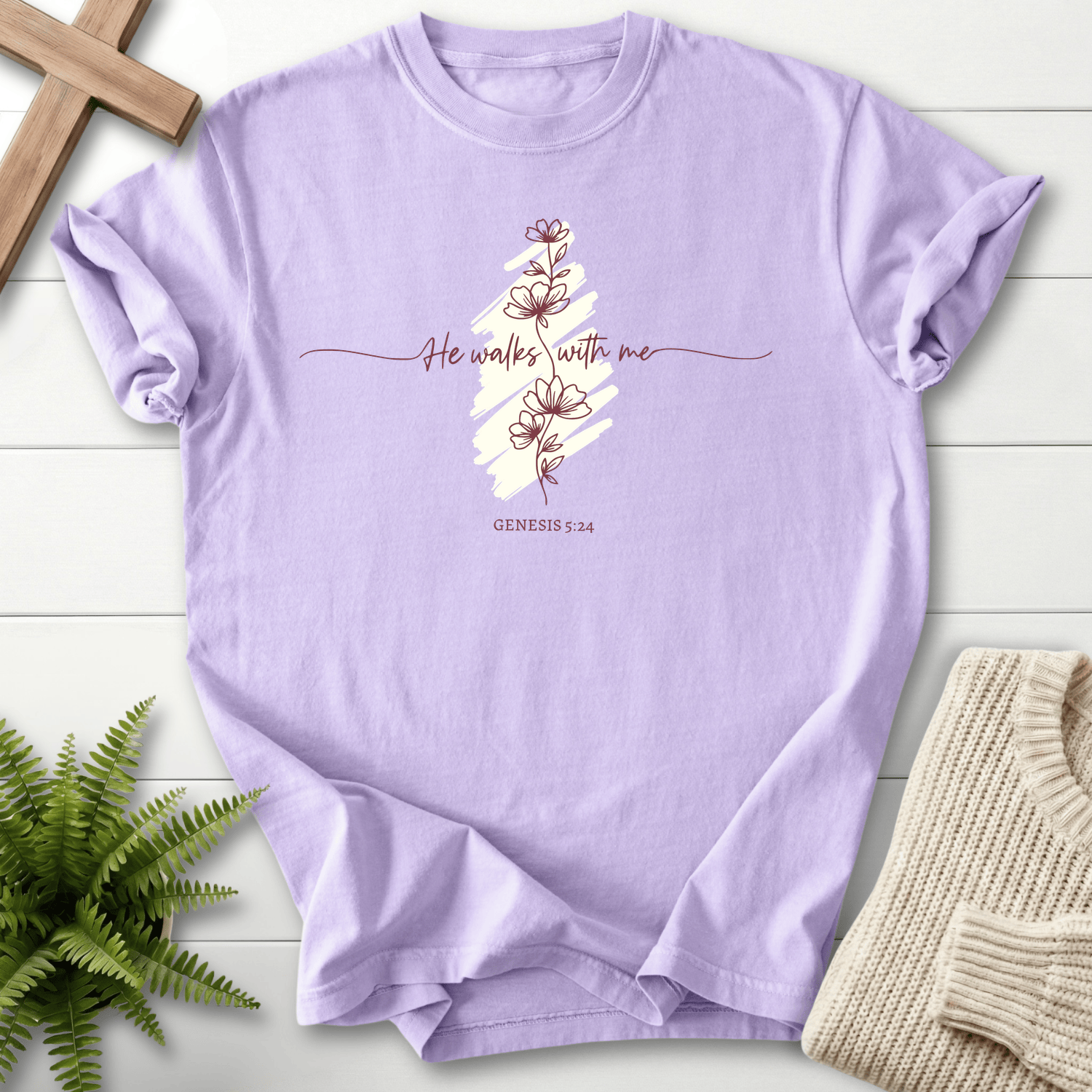 Orchid women's Christian t-shirt with "He Walks With Me" script over a brushstroke stripe and flower art