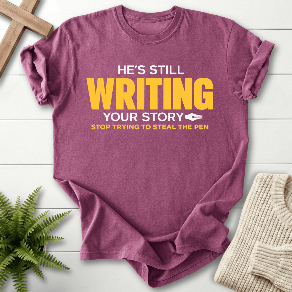 He's Still Writing Your Story T-Shirt in Berry | She Wears Faith
